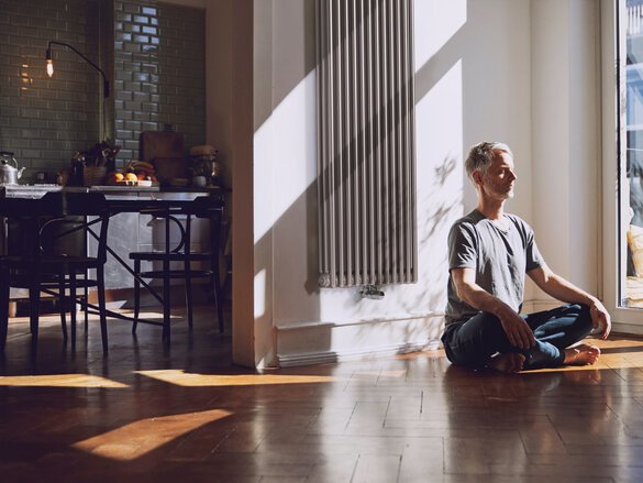 man meditates, old building flat, relaxed, charleston