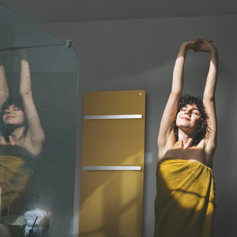 Beautiful young woman doing morning routine at home, sunny day. A woman in a towel does a warm-up after a shower.